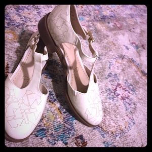 Clark’s white dancing shoes!